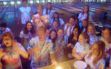 summer students in tye dye at a bowling ally